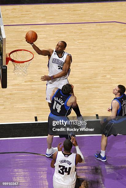 Carl Landry of the Sacramento Kings shoots a layup against Eduardo Najera of the Dallas Mavericks during the game at Arco Arena on April 10, 2010 in...