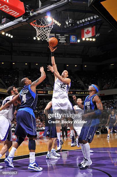 Francisco Garcia of the Sacramento Kings puts up a shot against Caron Butler and Jason Terry of the Dallas Mavericks during the game at Arco Arena on...