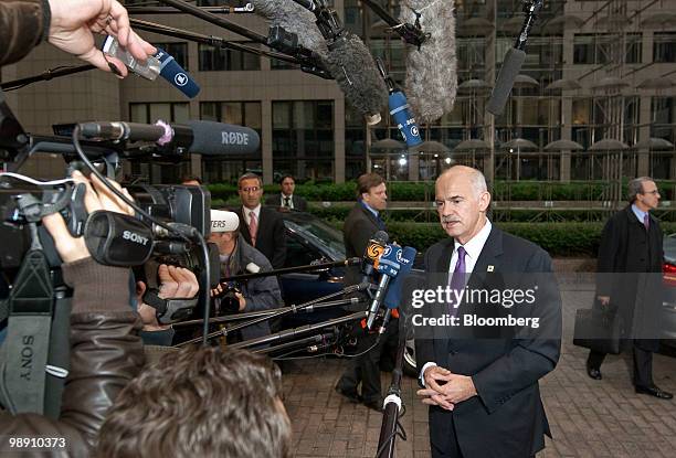 George Papandreou, Greece's prime minister, speaks to the media upon arriving for the European Union leaders' euro-region summit in Brussels,...