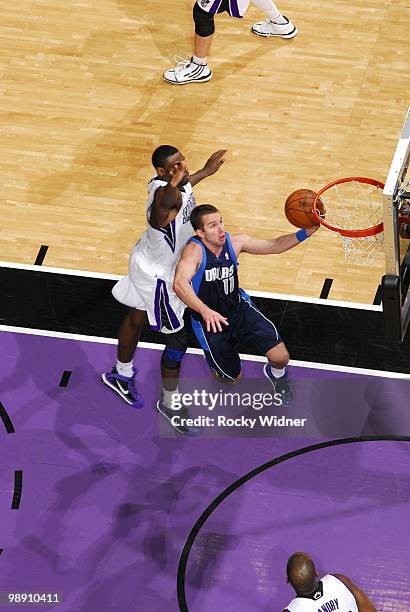 Jose Barea of the Dallas Mavericks shoots a layup against Tyreke Evans of the Sacramento Kings during the game at Arco Arena on April 10, 2010 in...