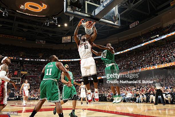 Shaquille O'Neal of the Cleveland Cavaliers slam dunks over Glen Davis, Rasheed Wallace and Tony Allen of the Boston Celtics in Game Two of the...