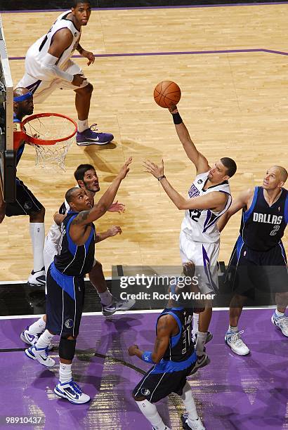 Francisco Garcia of the Sacramento Kings puts up a shot against Caron Butler, Jason Terry and Jason Kidd of the Dallas Mavericks during the game at...