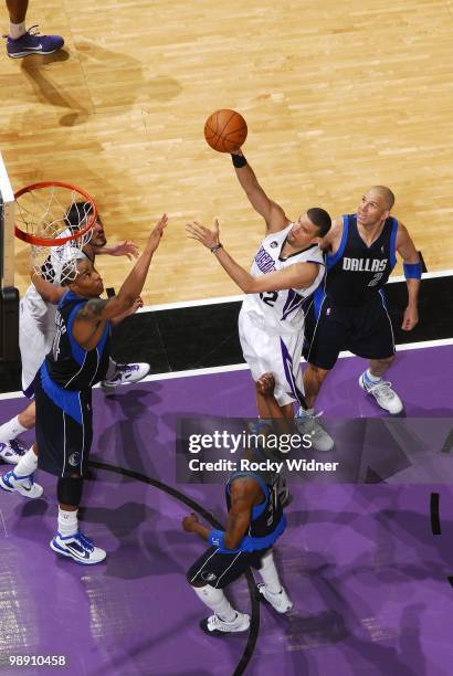 Francisco Garcia of the Sacramento Kings puts up a shot against Caron Butler, Jason Terry and Jason Kidd of the Dallas Mavericks during the game at...