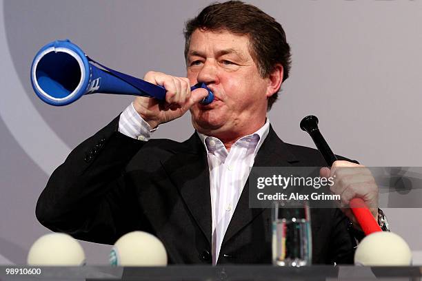 Otto Rehhagel, head coach of the Greecelebrates a goal national football team, blows into a vuvuzela during the DFB Live at the Steigenberger Airport...