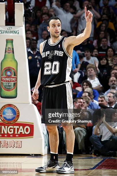 Manu Ginobili of the San Antonio Spurs signals from the court during the game against the Cleveland Cavaliers at Quicken Loans Arena on March 8, 2010...