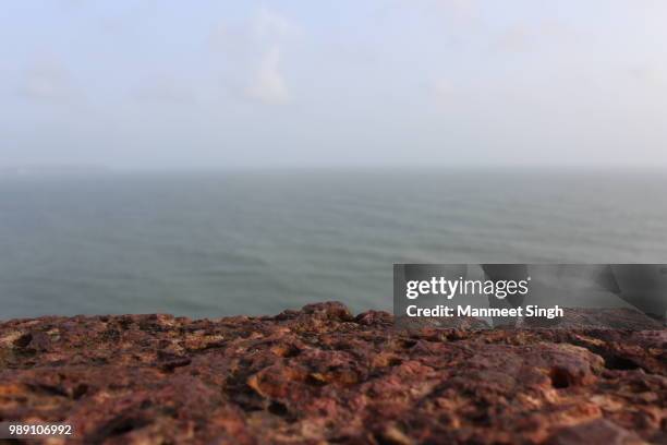 endless view of sinquerim beach, goa, india - sinquerim beach stock pictures, royalty-free photos & images