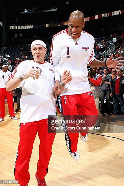 Mike Bibby and Maurice Evans of the Atlanta Hawks jump up before the game against the Detroit Pistons on March 13, 2010 at Philips Arena in Atlanta,...
