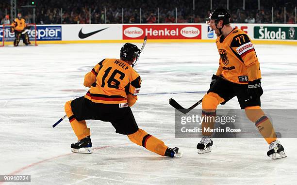 Michael Wolf of Germany celebrates after he scores his team's opening goal during the IIHF World Championship group D match between USA and Germany...