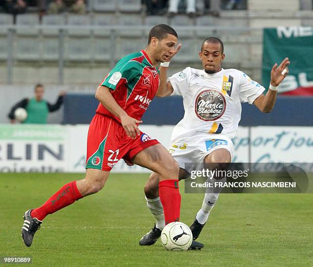 Sedan's forward Eyemen Henaini vies with Arles-Avignon's defender Marvin Esor during the French L2 football match Sedan vs. Arles-Avignon, on May 7,...