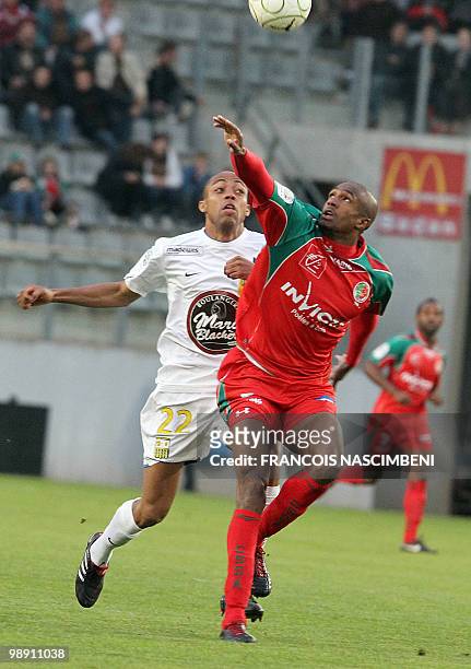 Sedan's defender Kassim Abdallah vies with Arles-Avignon's midfielder Gael Germany during the French L2 football match Sedan vs. Arles-Avignon, on...