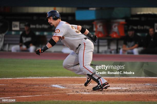 Aaron Rowand of the San Francisco Giants runs to first base during a MLB game against the Florida Marlins in Sun Life Stadium on May 5, 2010 in...