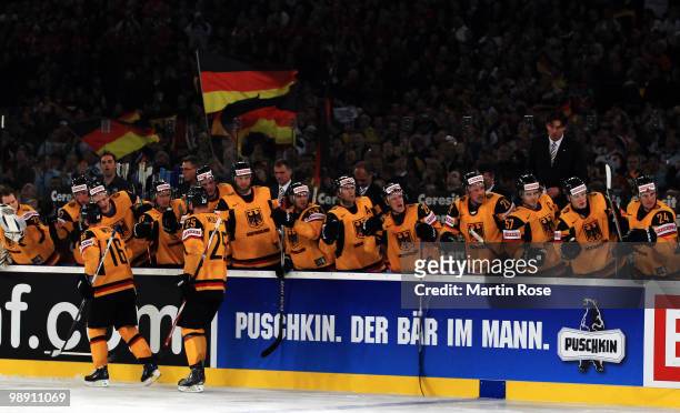 The team of Germany celebrate their team's opening goal during the IIHF World Championship group D match between USA and Germany at Veltins Arena on...