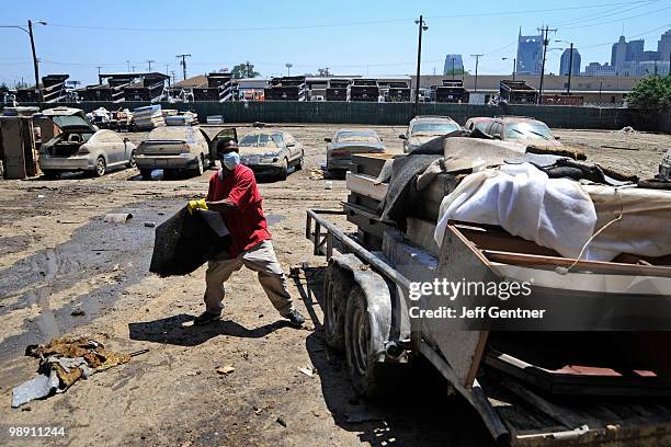 Josh Humphries hauls flooded wet carpet out of the Knights Inn near downtown on May 7, 2010 in Nashville, Tennessee. Massive rainstorms caused at...