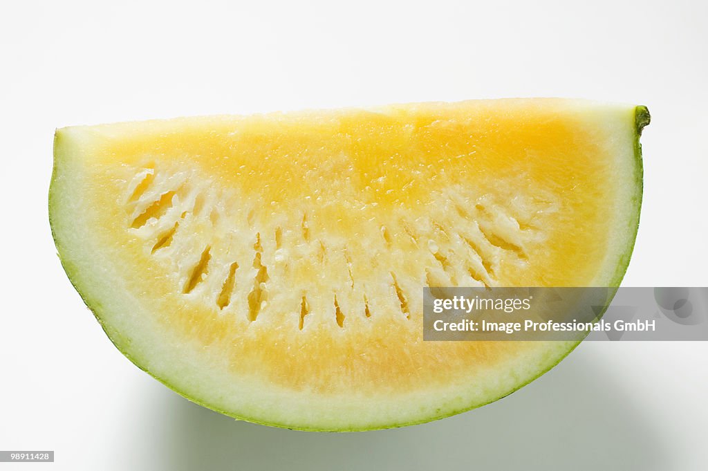 Yellow seedless watermelon on white background