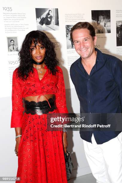 Naomi Campbell and Director of Alaia, Eric Vallat attend "L'Alchimie secrete d'une collection - The Secret Alchemy of a Collection" Exhibition...