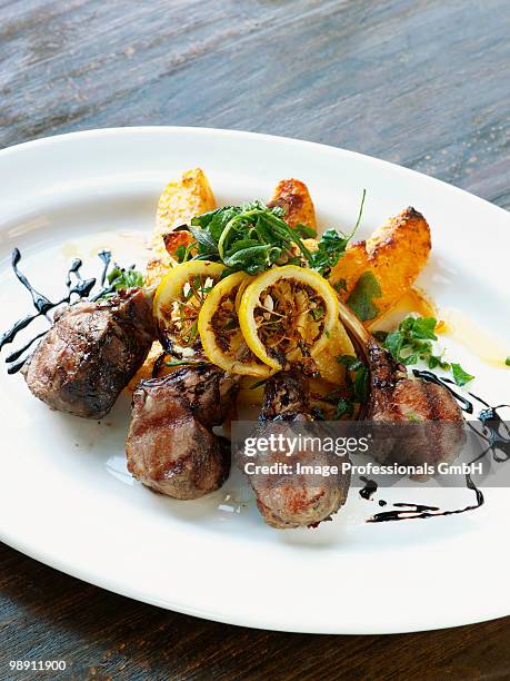 lamb chops with lemon and potatoes in plate. - lamb cutlets bildbanksfoton och bilder