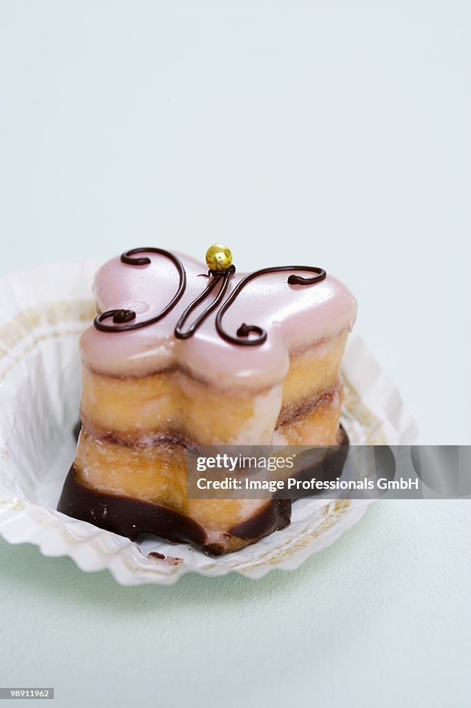 Petit four in paper case, close-up