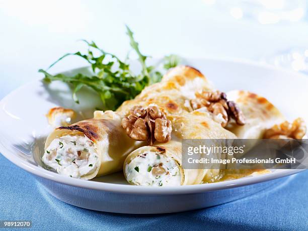 cannelloni with fresh goat's cheese and walnuts, close-up - cannelloni stock pictures, royalty-free photos & images