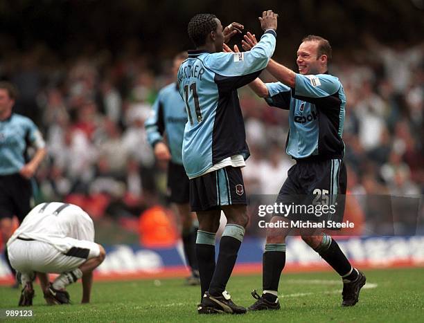 Simon Charlton and Ricardo Gardner of Bolton celebrate gaining promotion into the Premiership after the match between Bolton Wanderers and Preston...