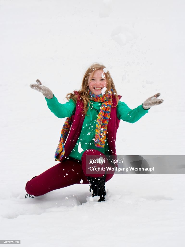 Young woman, 20 years, in winter clothes in snow