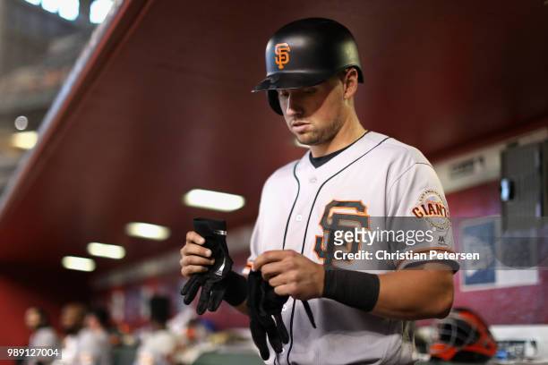 Joe Panik of the San Francisco Giants prepares to bat during the sixth inning of the MLB game against the Arizona Diamondbacks at Chase Field on July...