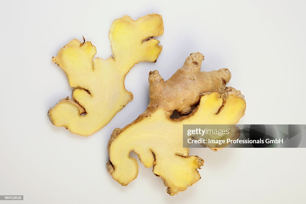 Slices of ginger root on white background, close-up