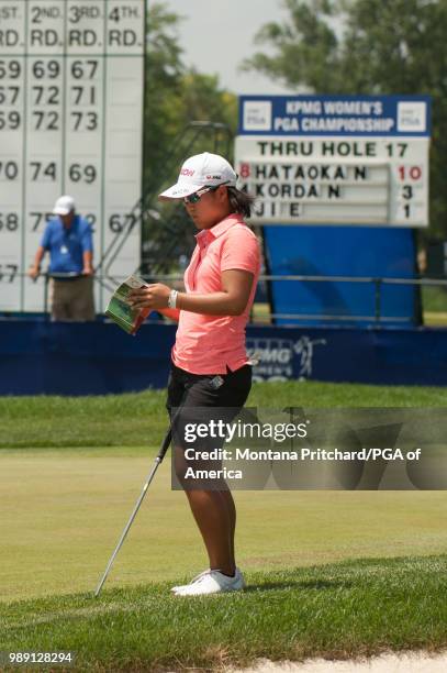 Nasa Hataoka of Japan reads her yardage on the 18th hole during the final round of the 2018 KPMG Women's PGA Championship at Kemper Lakes Golf Club...