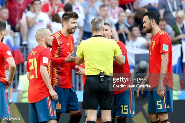 David Silva, Gerard Pique, Sergio Ramos, Sergio Busquets of Spain argue for the penalty with referee Bjorn Kuipers of the Netherlands during the 2018...