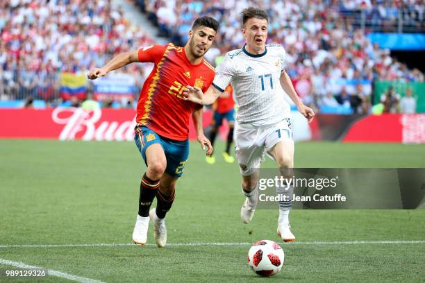 Marco Asensio of Spain, Aleksandr Golovin of Russia during the 2018 FIFA World Cup Russia Round of 16 match between Spain and Russia at Luzhniki...