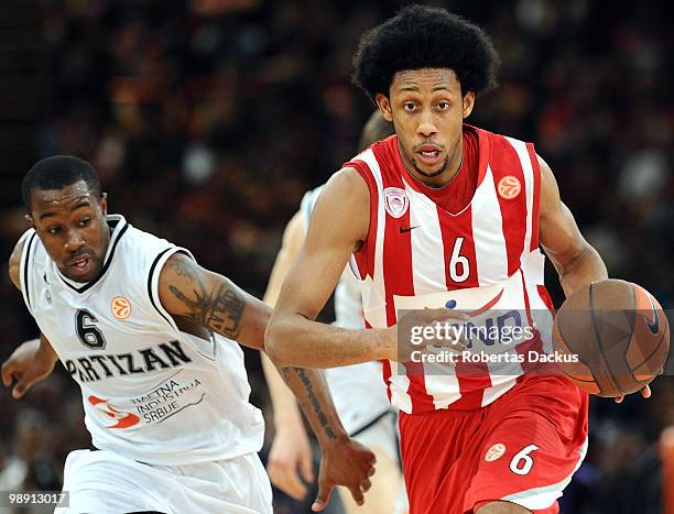 Josh Childress, #6 of Olympiacos Piraeus competes with Lester McCalebb, #6 of Partizan Belgrade in action during the Euroleague Basketball Semifinal...