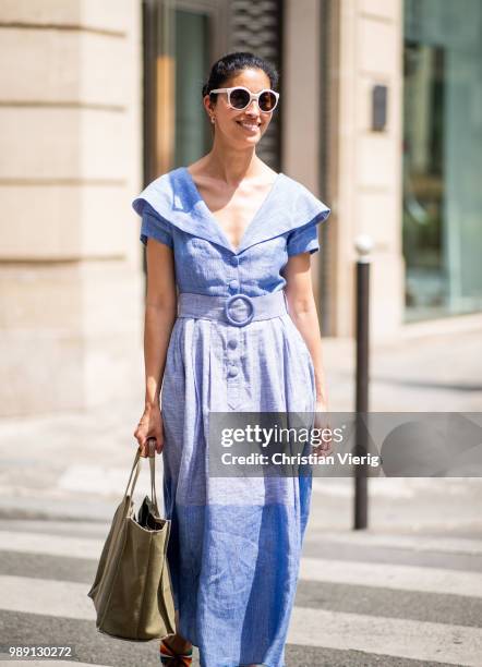 Caroline Issa wearing blue dress is seen outside Hermes Resort during Paris Fashion Week Haute Couture FW18 on July 1, 2018 in Paris, France.