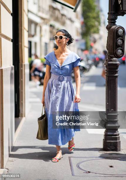Caroline Issa wearing blue dress is seen outside Hermes Resort during Paris Fashion Week Haute Couture FW18 on July 1, 2018 in Paris, France.