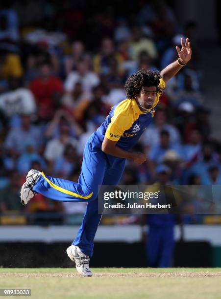 Lasith Malinga of Sri Lanka bowls during The ICC World Twenty20 Super Eight Match between The West Indies and India played at The Kensington Oval on...