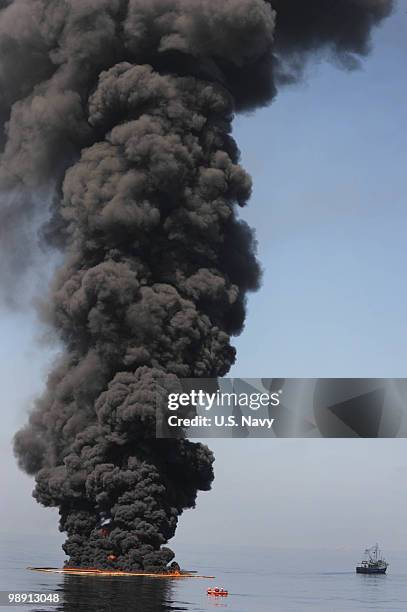 Oil burns during a controlled fire May 6, 2010 in the Gulf of Mexico. The U.S. Coast Guard is overseeing oil burns after the sinking, and subsequent...