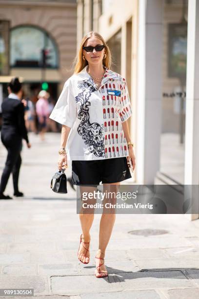 Pernille Teisbaek wearing Prada button shirts and shorts is seen outside Hermes Resort during Paris Fashion Week Haute Couture FW18 on July 1, 2018...