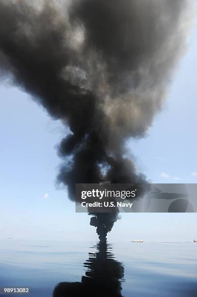 Oil burns during a controlled fire May 6, 2010 in the Gulf of Mexico. The U.S. Coast Guard is overseeing oil burns after the sinking, and subsequent...