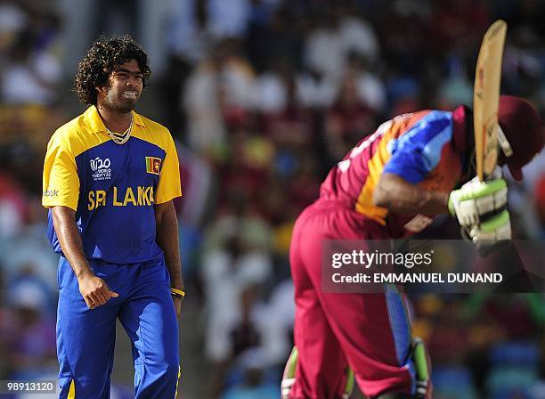 Sri Lankan bowler Lasith Malinga celebrates after taking the wicket of West Indies batsman Dwayne Bravo during the ICC World Twenty20 Super Eight...