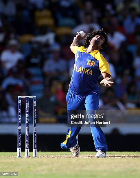 Lasith Malinga of Sri Lanka bowls during The ICC World Twenty20 Super Eight Match between The West Indies and India played at The Kensington Oval on...