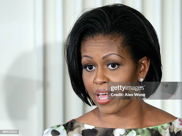 First lady Michelle Obama speaks as she hosts a Mother�s Day event at the State Dining Room of the White House May 7, 2010 in Washington, DC. Guests...