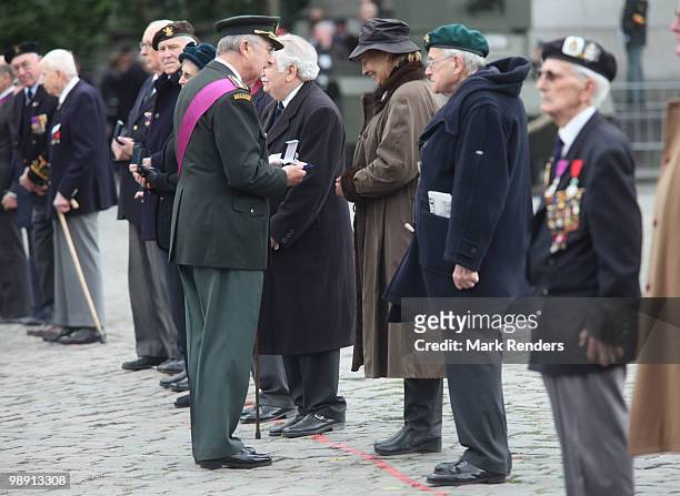 King Albert from Belgium decorates war heroes of WWII as he assists a memorial ceremony for the end of WWII at Esplanade du Cinquantenaire on May 7,...