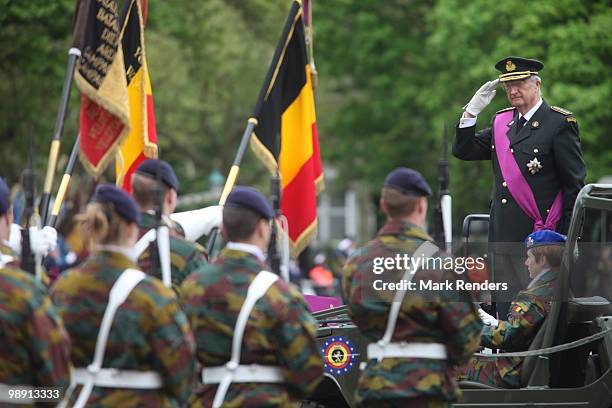 King Albert from Belgium salutes the troops as he assists a memorial ceremony for the end of WWII at Esplanade du Cinquantenaire on May 7, 2010 in...