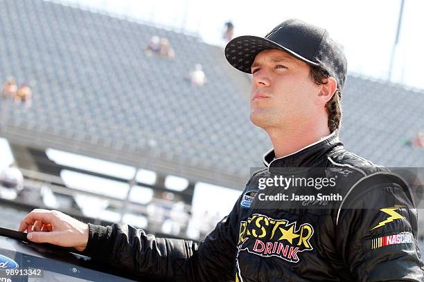 Josh Wise, driver of the Ride to the Rock for Autism Ford looks on during qualifying for the NASCAR Nationwide series Royal Purple 200 presented by...