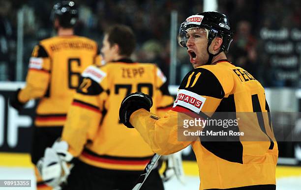 Sven Felski of Germany celebrates after the IIHF World Championship group D match between USA and Germany at Veltins Arena on May 7, 2010 in...