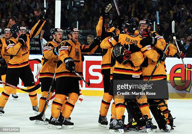 The team of Germany celebrate after winning the IIHF World Championship group D match between USA and Germany at Veltins Arena on May 7, 2010 in...