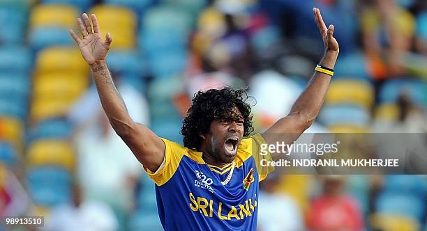 Sri Lankan cricketer Lasith Malinga celebrates after taking the wicket of West Indian cricketer Jerome Taylor during The ICC World Twenty20 Super 8...