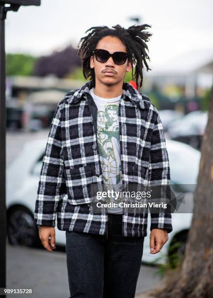 Luka Sabbat wearing checked jacket is seen outside Vetements during Paris Fashion Week Haute Couture FW18 on July 1, 2018 in Paris, France.