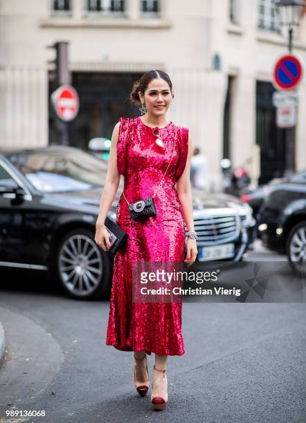 Araya Alberta Hargate wearing red dress is seen outside Givenchy during Paris Fashion Week Haute Couture FW18 on July 1, 2018 in Paris, France.