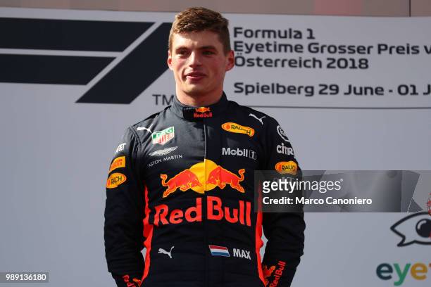 Race winner Max Verstappen of Netherlands and Red Bull Racing celebrates on the podium during Formula One Grand Prix of Austria.