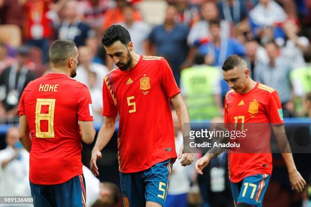 Koke and Sergio Busquets of Spain are seen during the 2018 FIFA World Cup Russia Round of 16 match between Spain and Russia at the Luzhniki Stadium...