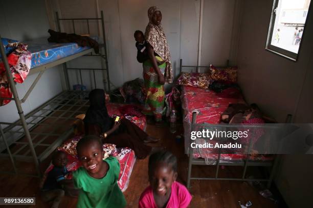 African migrants who will be repatriated to their countries by Algerian government, are seen at a temporary refuge center, near the border of Niger...